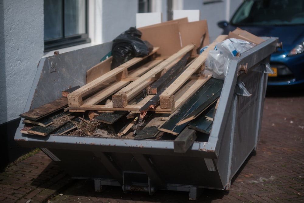 Skip bin filled with renovation timber and household waste outside a Melbourne home